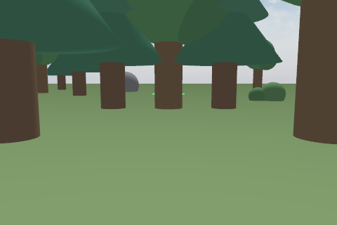 Low onboard camera view between tree trunks with a rock and bushes in the distance
